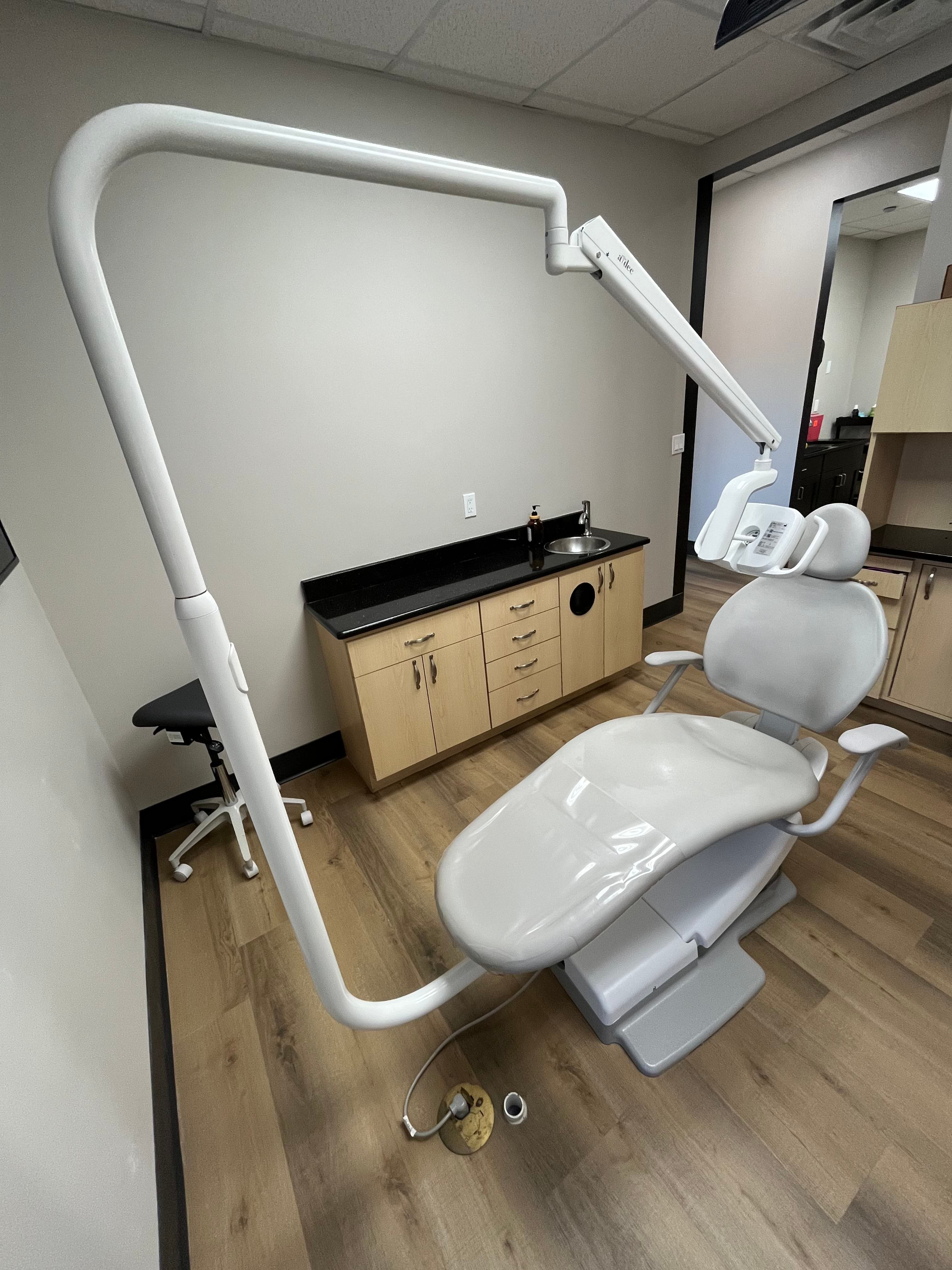 Used dental chair being positioned in new operatory