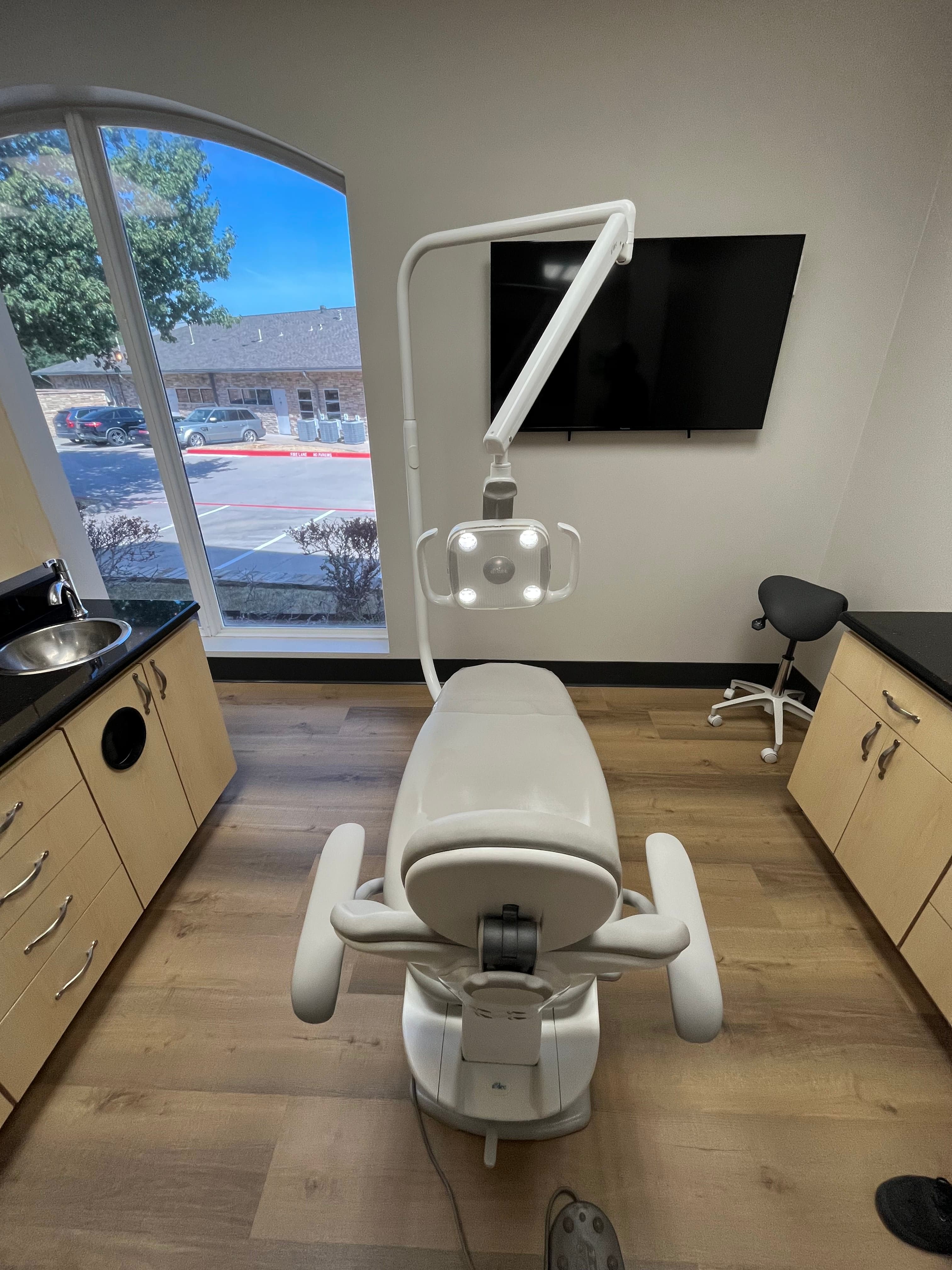 Completed dental chair installation with LED operating light in Texas practice